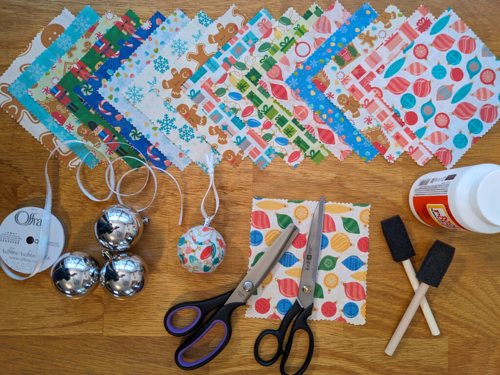 Craft flat lay picture of all the supplies needed to create fabric wrapped Christmas Tree Ornaments