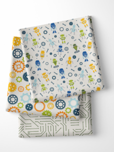 Folded fabric samples displaying colorful robot designs. Various swatches show playful illustrations of gears, circuits and whimsical robots in vibrant colors.