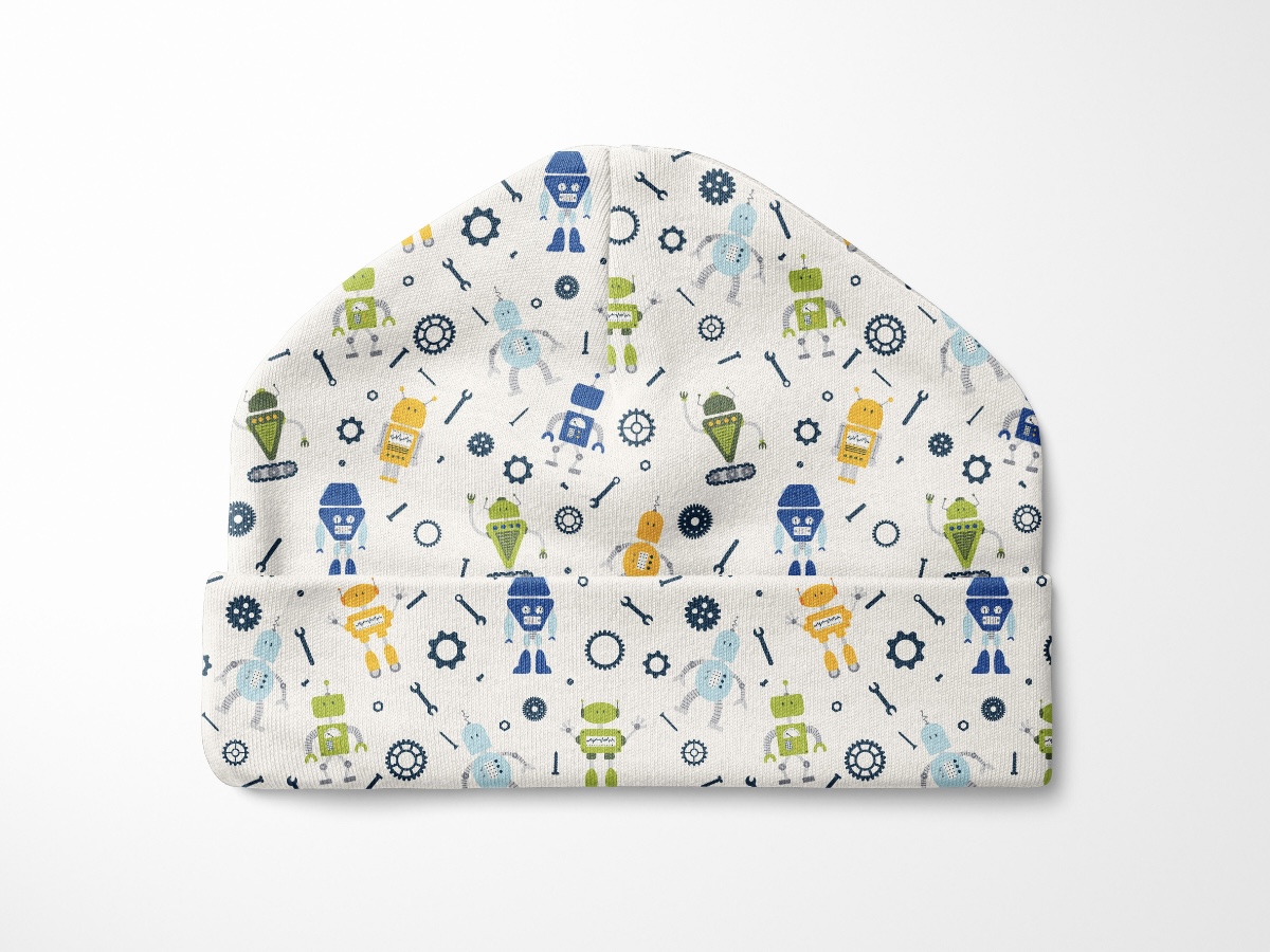 Mockup of a baby jat made with fabric featuring colorful robot designs. 