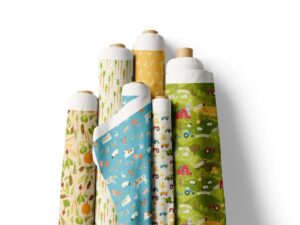 Rolls of fabric featuring farm themed patterns